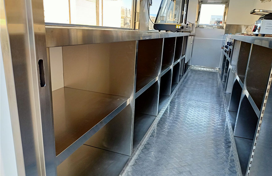 the kitchen equipment in a shipping container bar