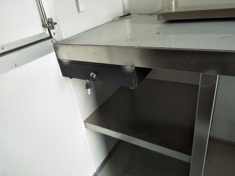 stainless steel work table with a cash drawer