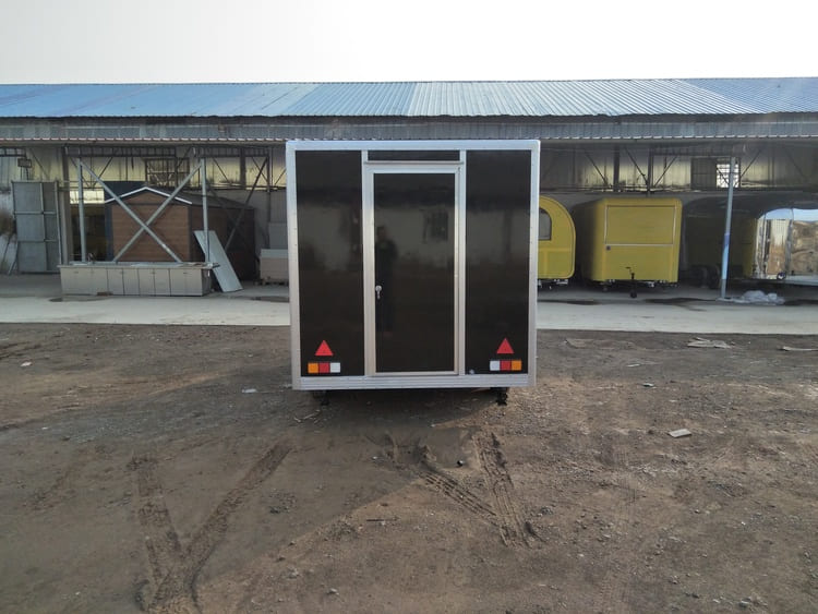 the tail lights of the enclosed bbq trailer