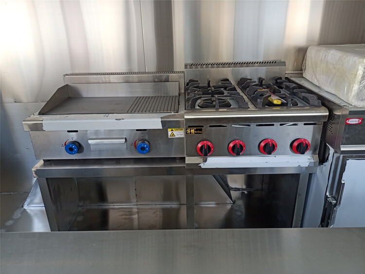 grill and gas stove in the 19ft custom pizza food trailer